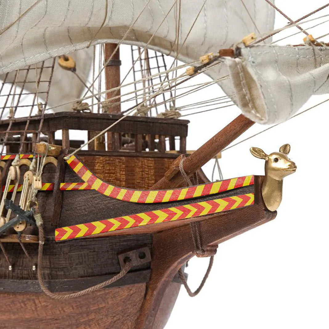 Close up of the golden deer figurehead and decorative bow chevron striping on the Occre Golden Hind 