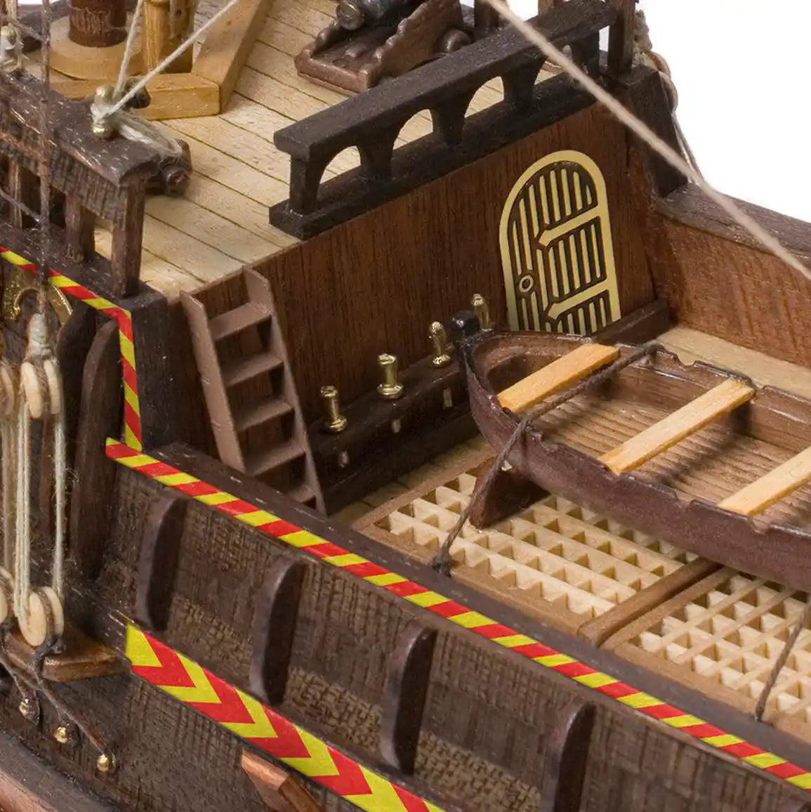 Overhead view of the Occre Golden Hind main deck with planked tender boat hatches and belaying pins 