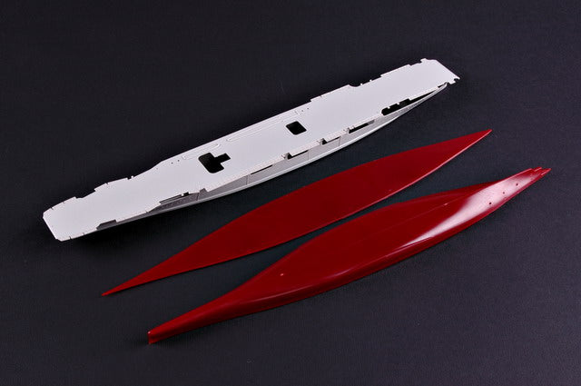Unassembled full hull lower section waterline plate and unpainted plastic main flight deck piece