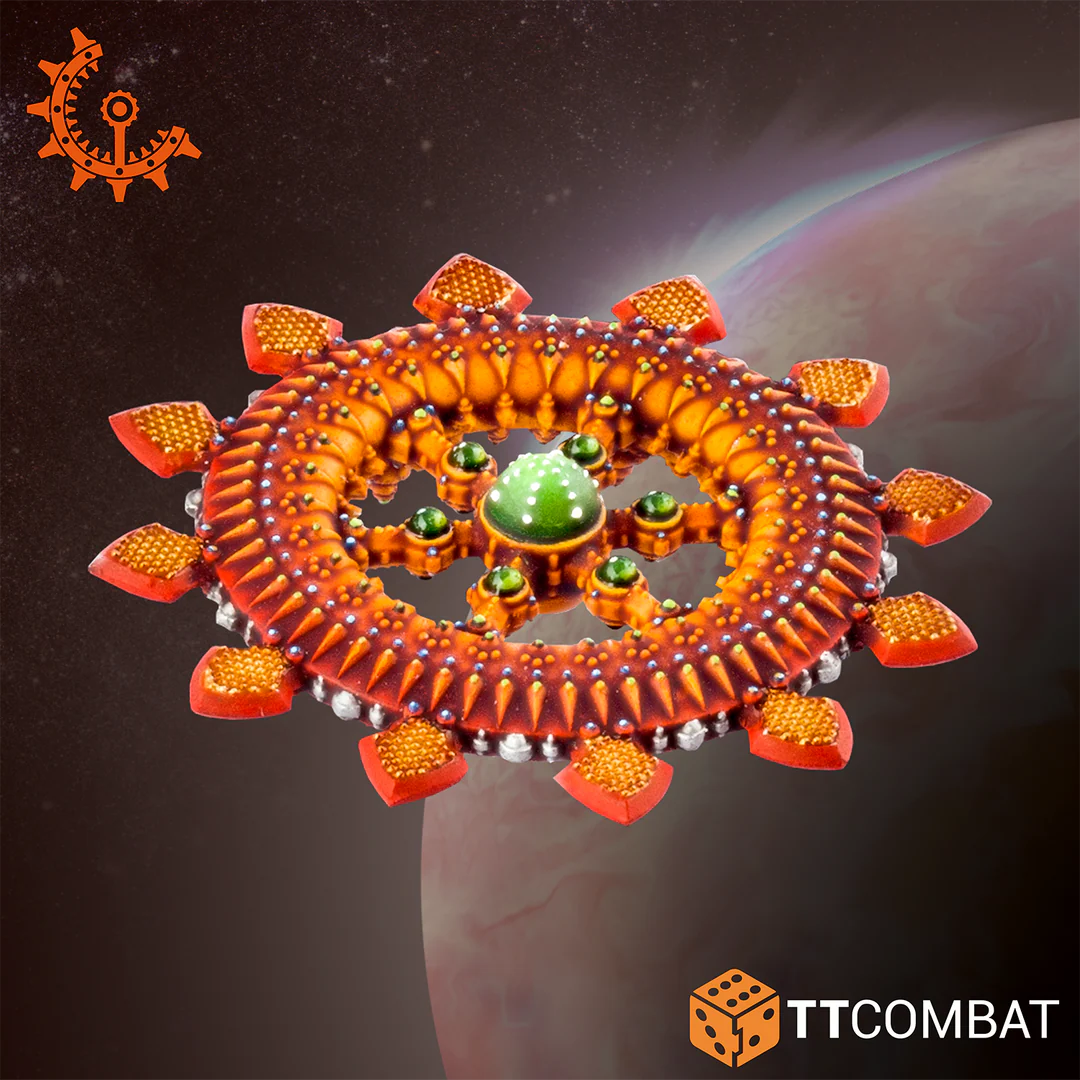 Overhead view of an ornate circular Shaltari Voidgate miniature detailed with orange heat sinks and a bright green center dome