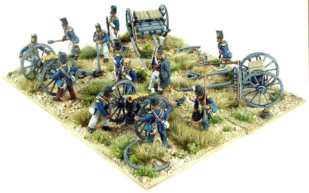 Top-down scenic view of three painted Victrix 28mm British cannons with limbers and crew