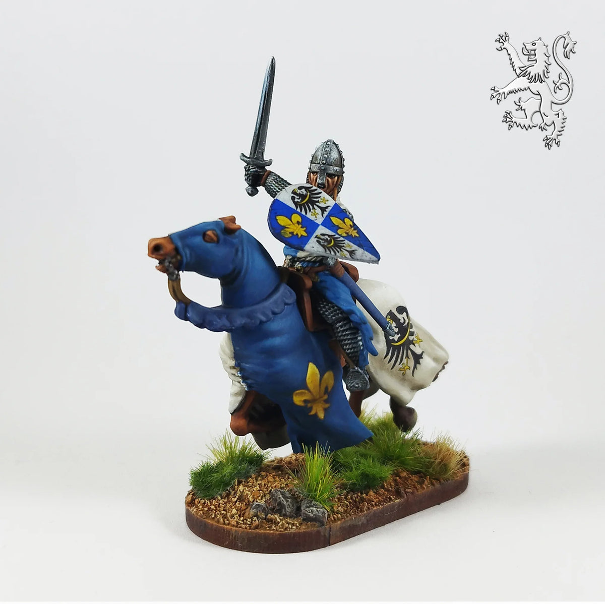 Painted Victrix 28mm medieval knight charging on blue barded mount with raised sword and quartered shield 