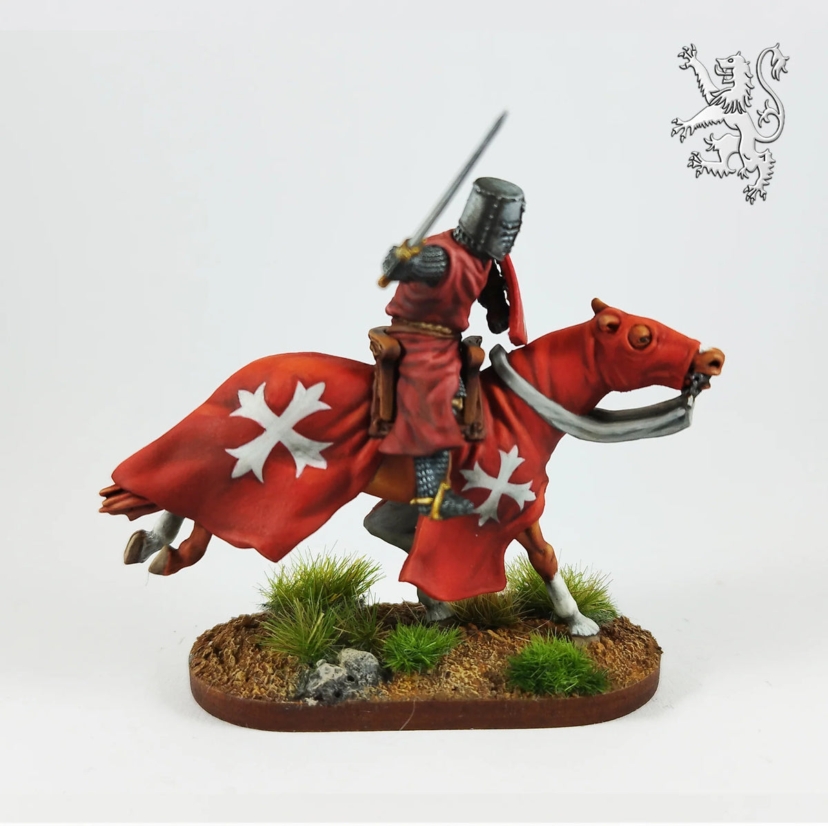 Painted Victrix 28mm knight with raised sword riding a galloping horse in red cross caparison 