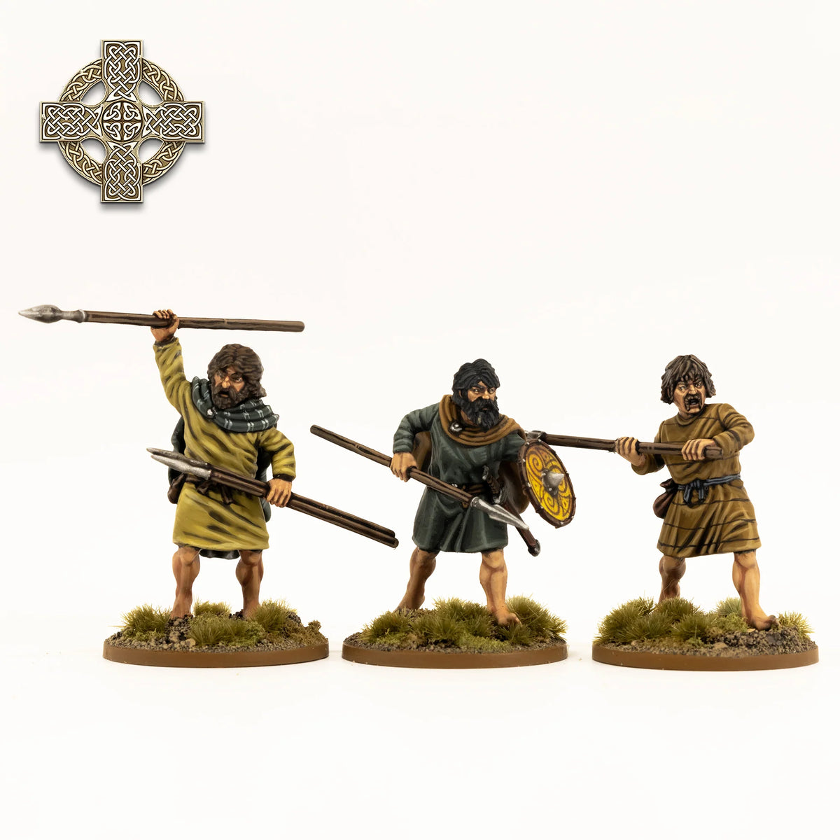 Three painted Victrix 28mm Irish warriors thrusting and bracing spears in tunics 