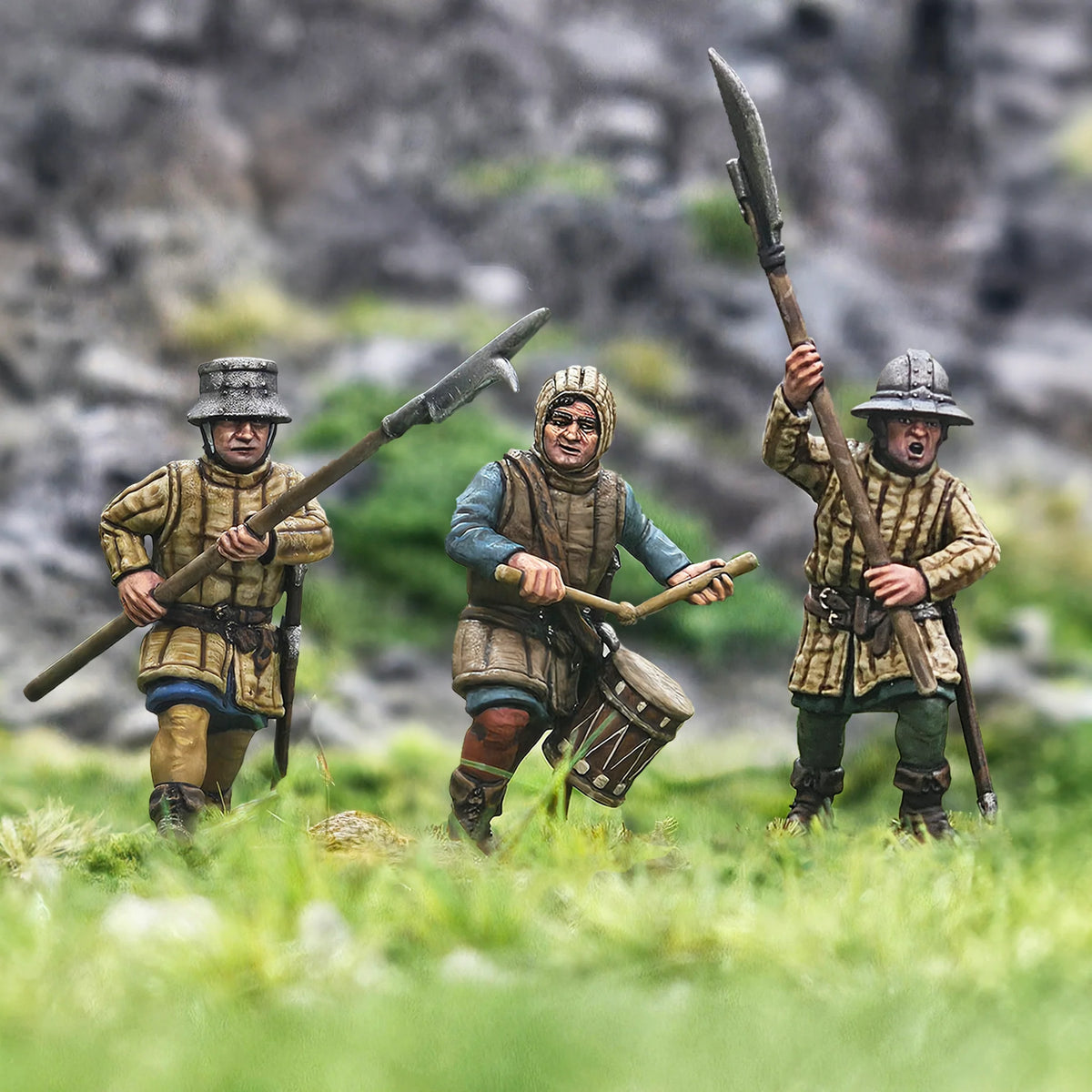 Close-up of three painted Victrix 28mm foot sergeants in kettle hats and arming caps including a drummer 