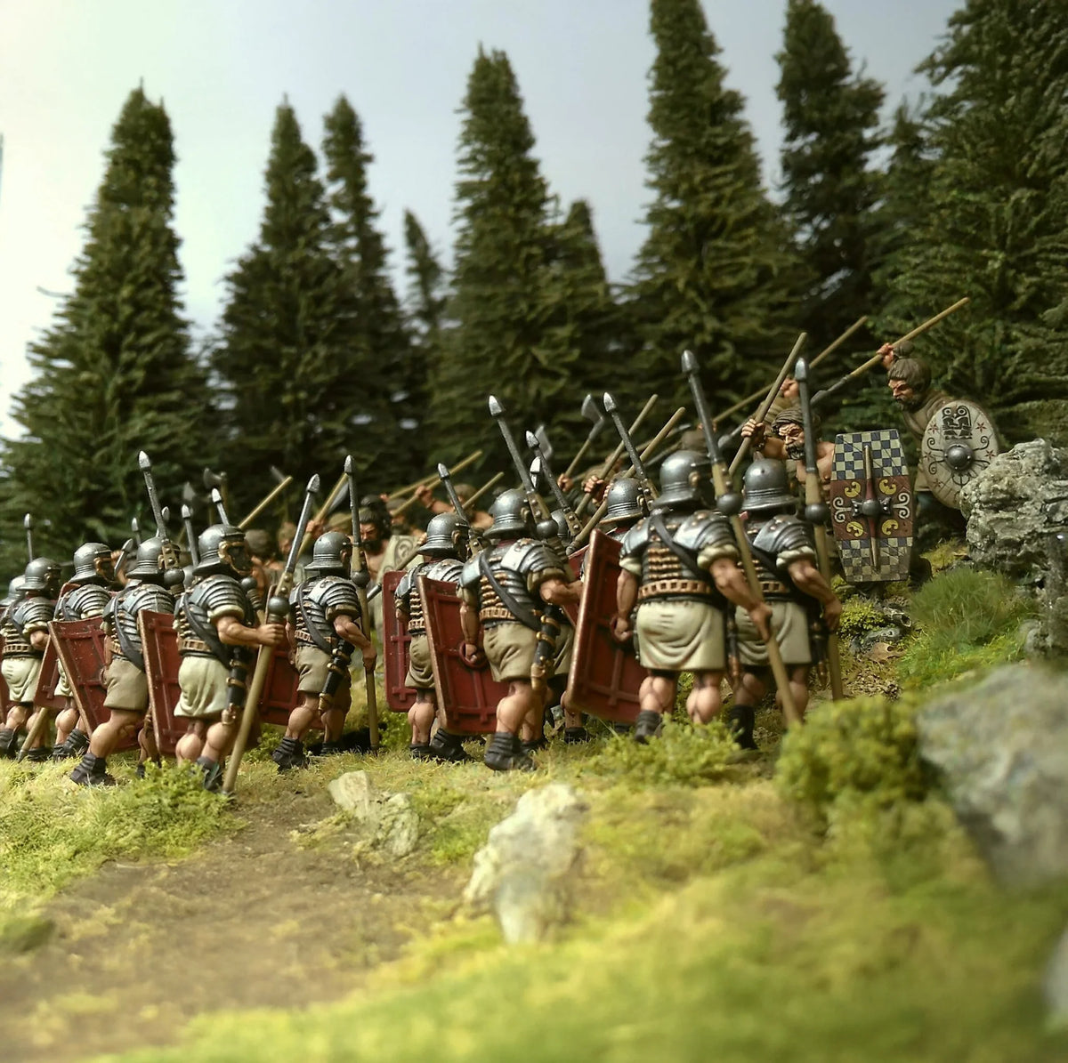 Rear view of painted Victrix 28mm Imperial Roman legionaries advancing into a forest against Celtic warriors 