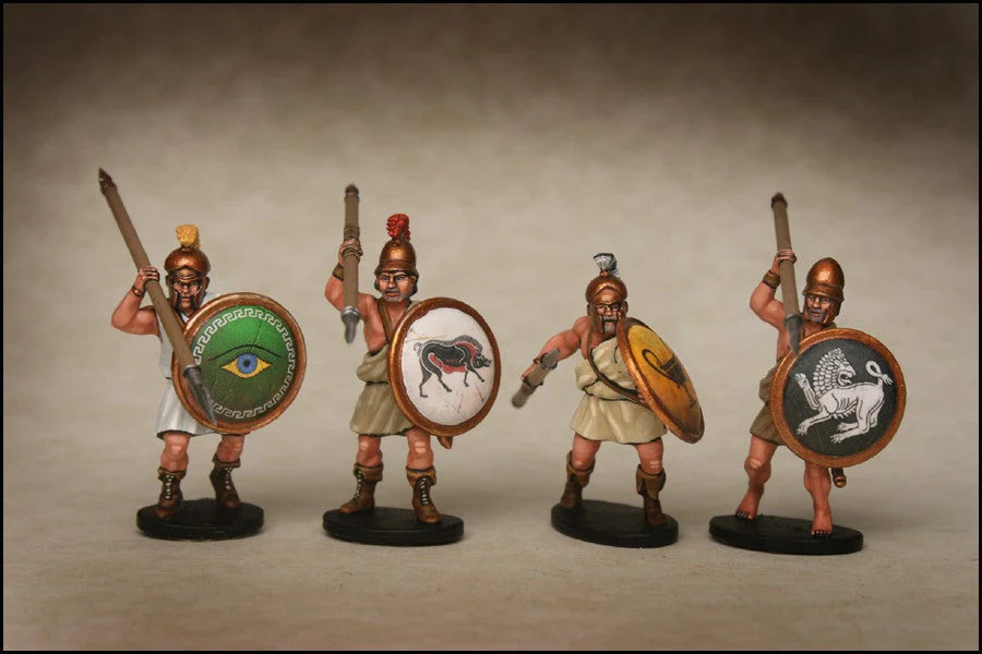 Four painted Victrix 28mm Greek unarmoured hoplites advancing with upright and leveled spears
