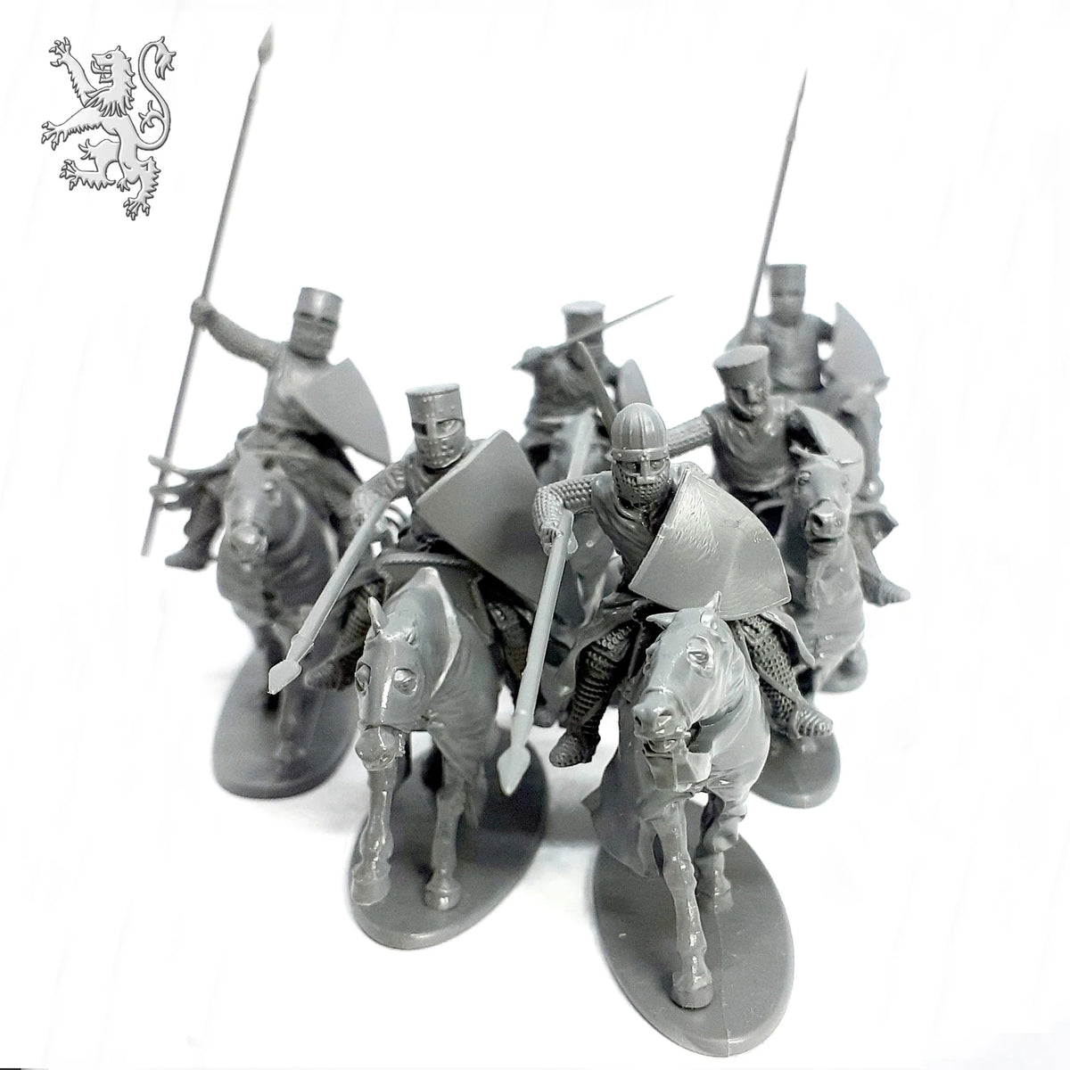 Front angle of six assembled unpainted gray plastic Victrix 28mm mounted medieval knights with lances and Great Helms 