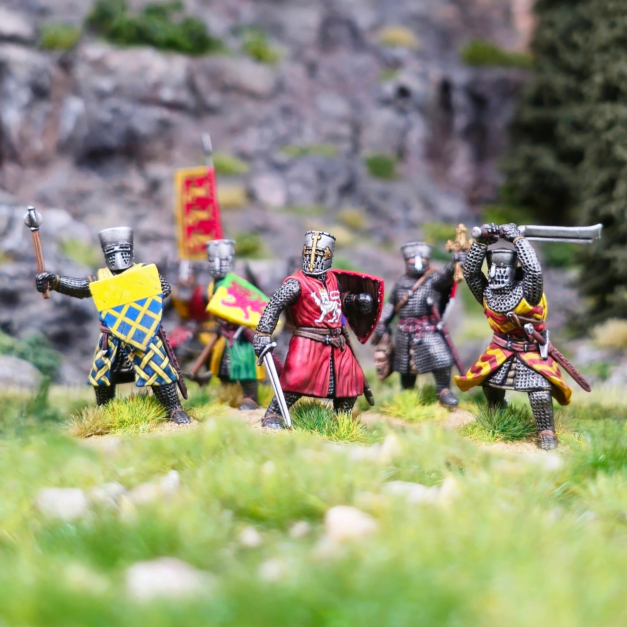 Array of painted Victrix 28mm heraldic foot knights with swords and axes