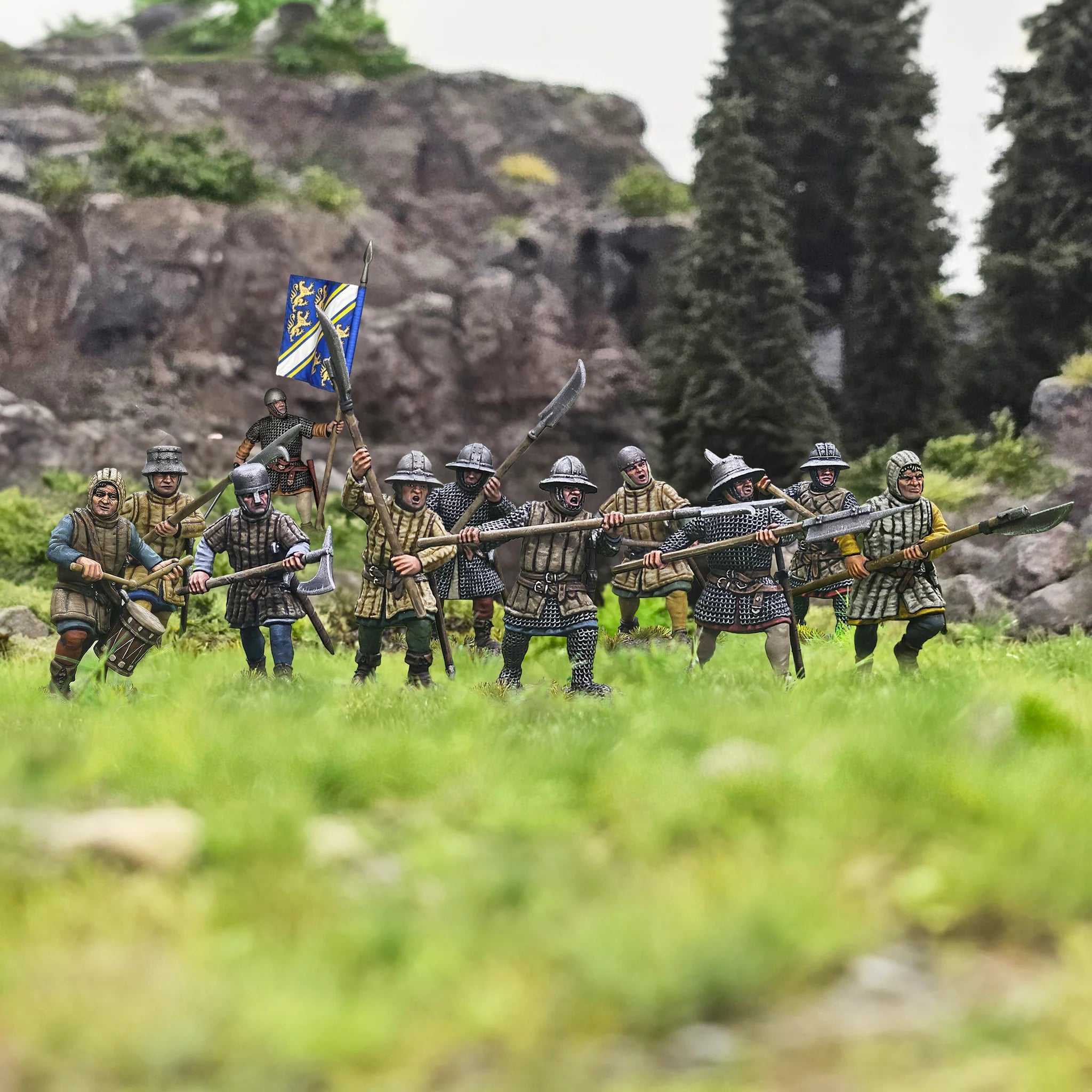 Line of painted Victrix 28mm foot sergeants advancing with polearms