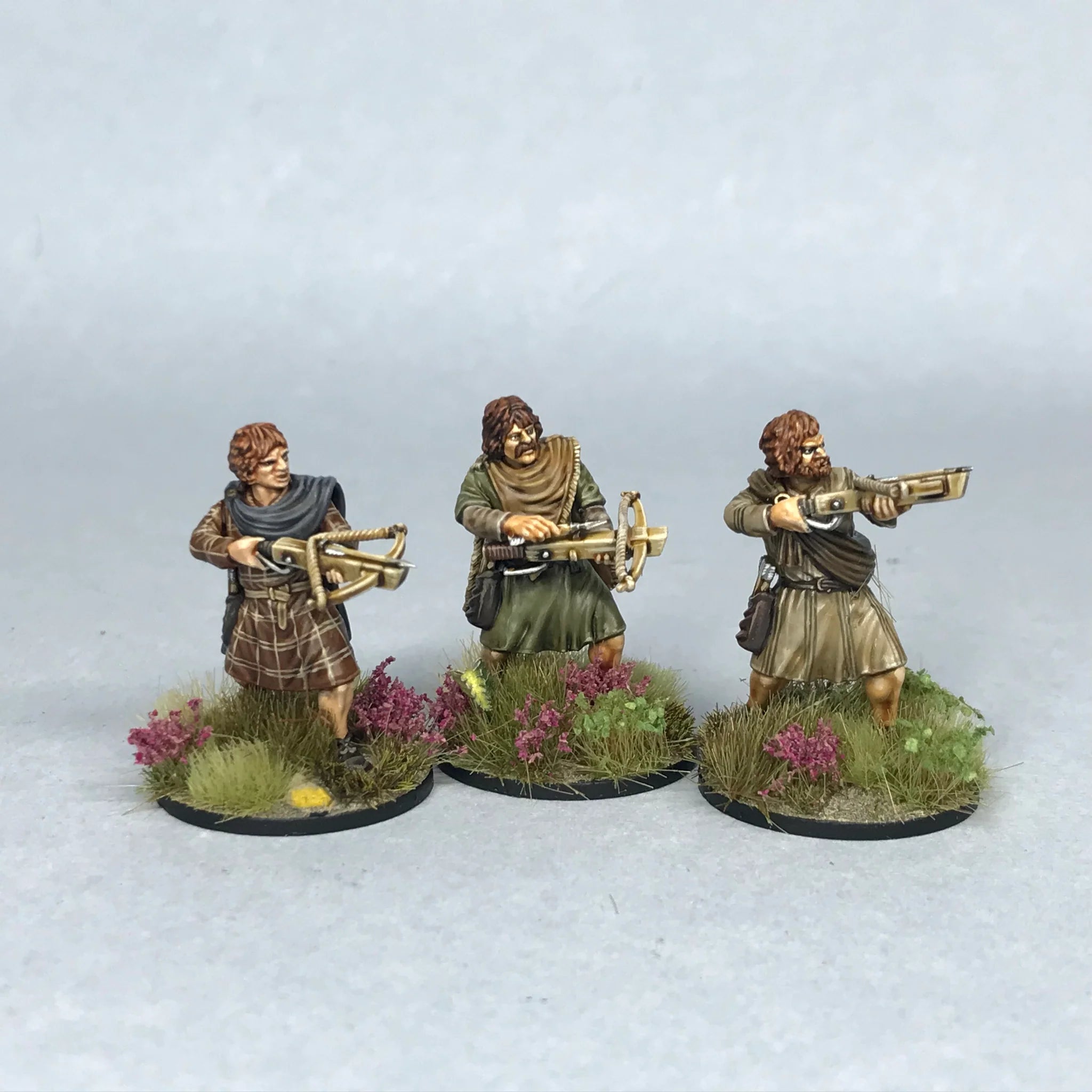 Detailed view of three painted Victrix 28mm Pictish crossbowmen with historical arcuballista variants