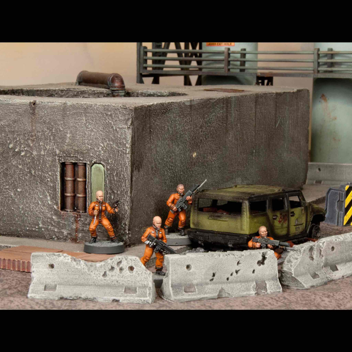 Four painted 28mm female miniatures displayed in space suits and orange convict jumpsuits