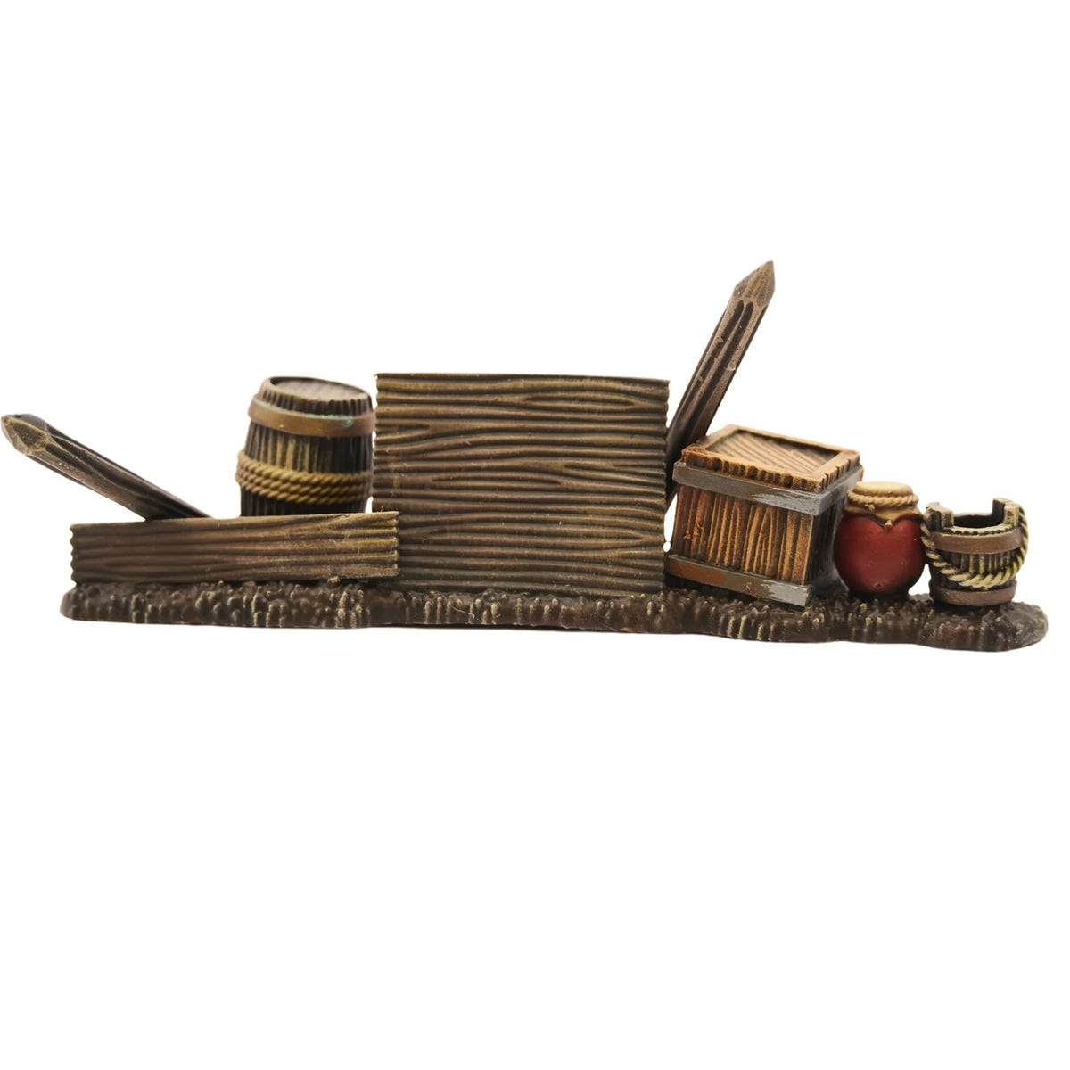 Painted street barricade constructed from wooden planks, barrels, crates, clay pot, and stakes 