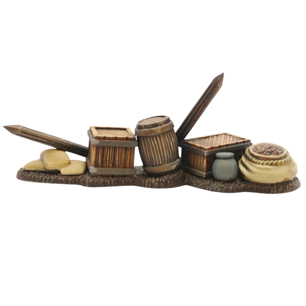 Painted defensive obstacle assembled with supply chests, vertical palisade stakes, and grain bags 