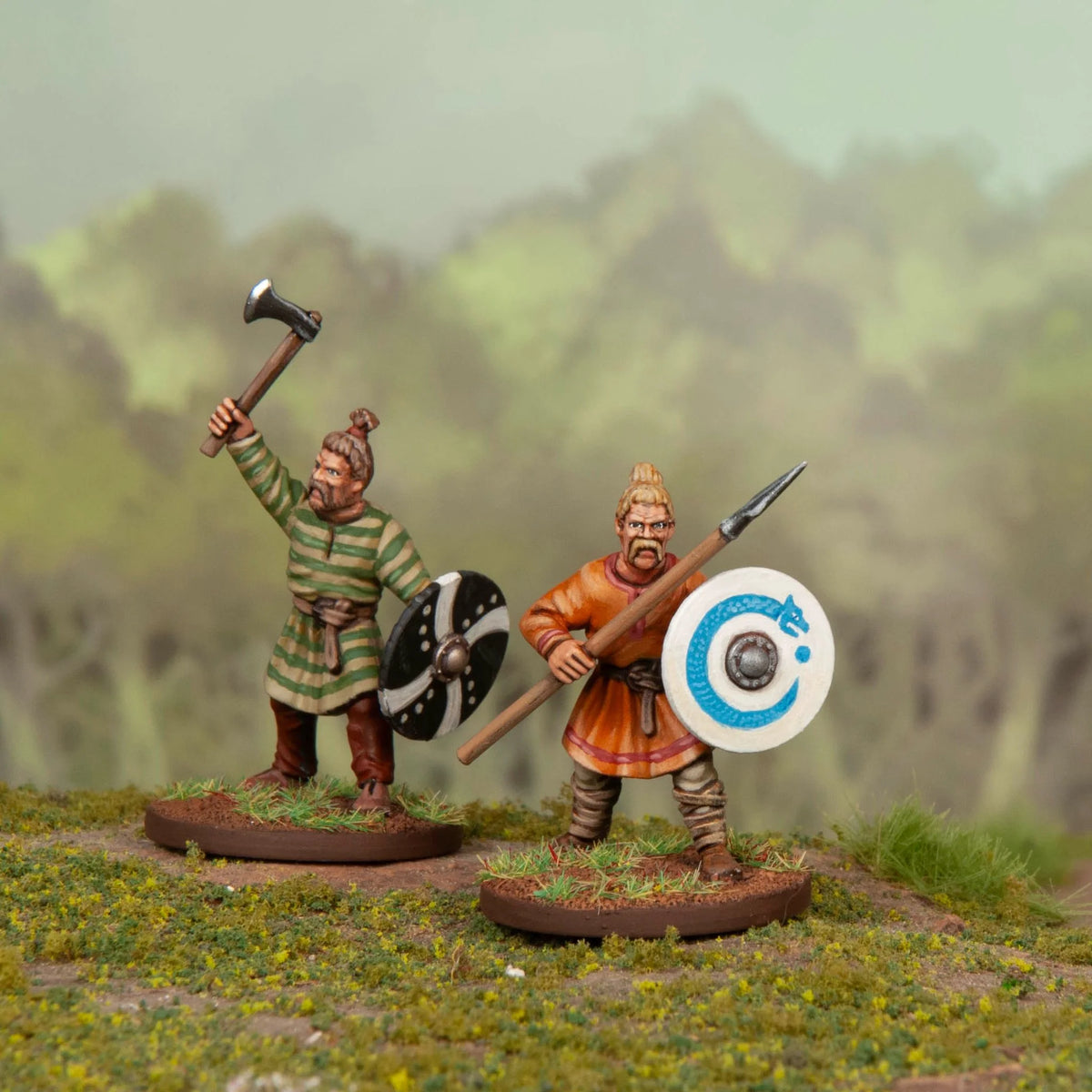 Two painted Frankish warriors with Suebian hair knots holding an axe spear and shields 