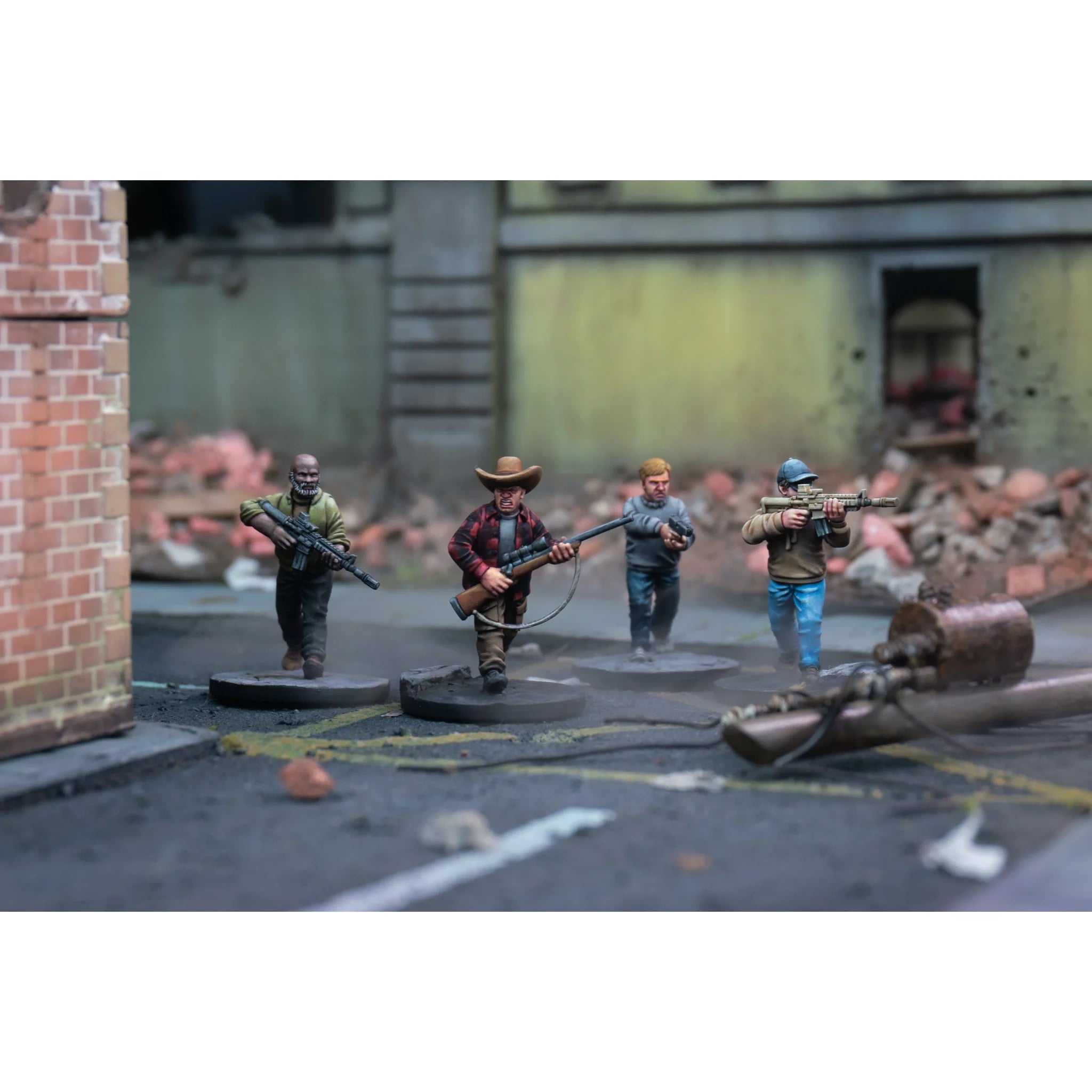 Four painted survivor models armed with an assault rifle submachine gun and scoped sniper rifle