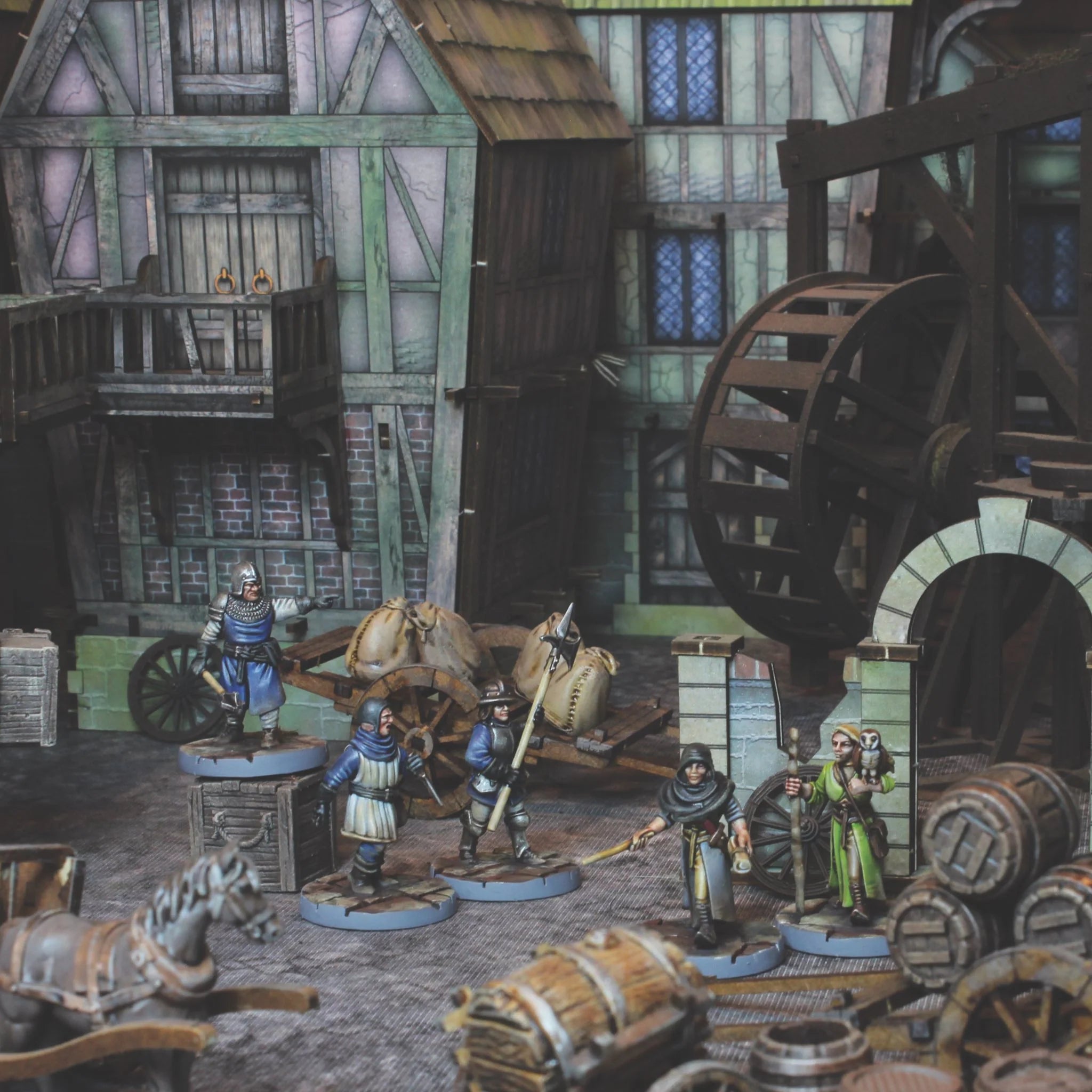 Painted Wargames Atlantic Guards patrolling a fantasy city street.