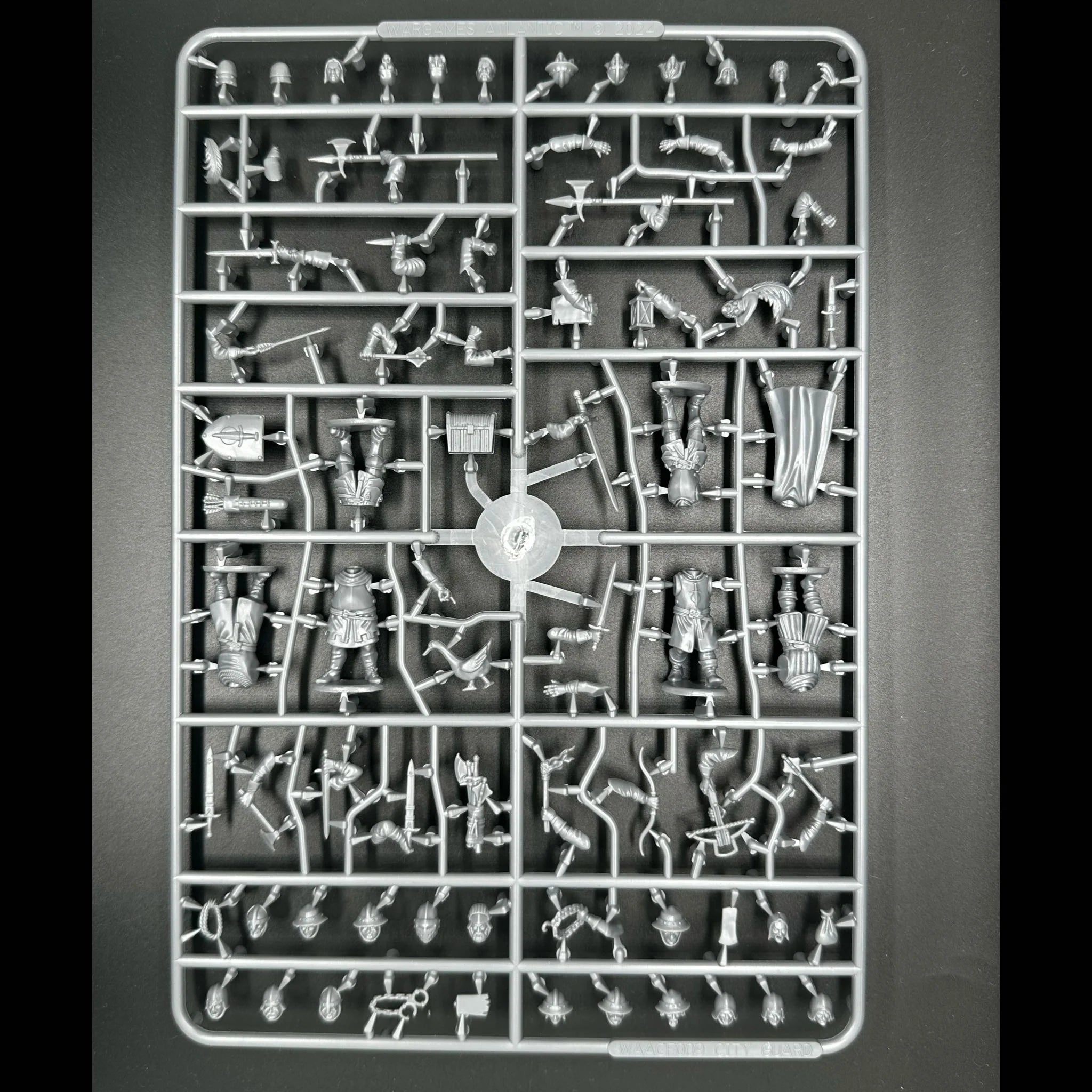 Front of Wargames Atlantic Guards sprue showing weapons and 26 heads