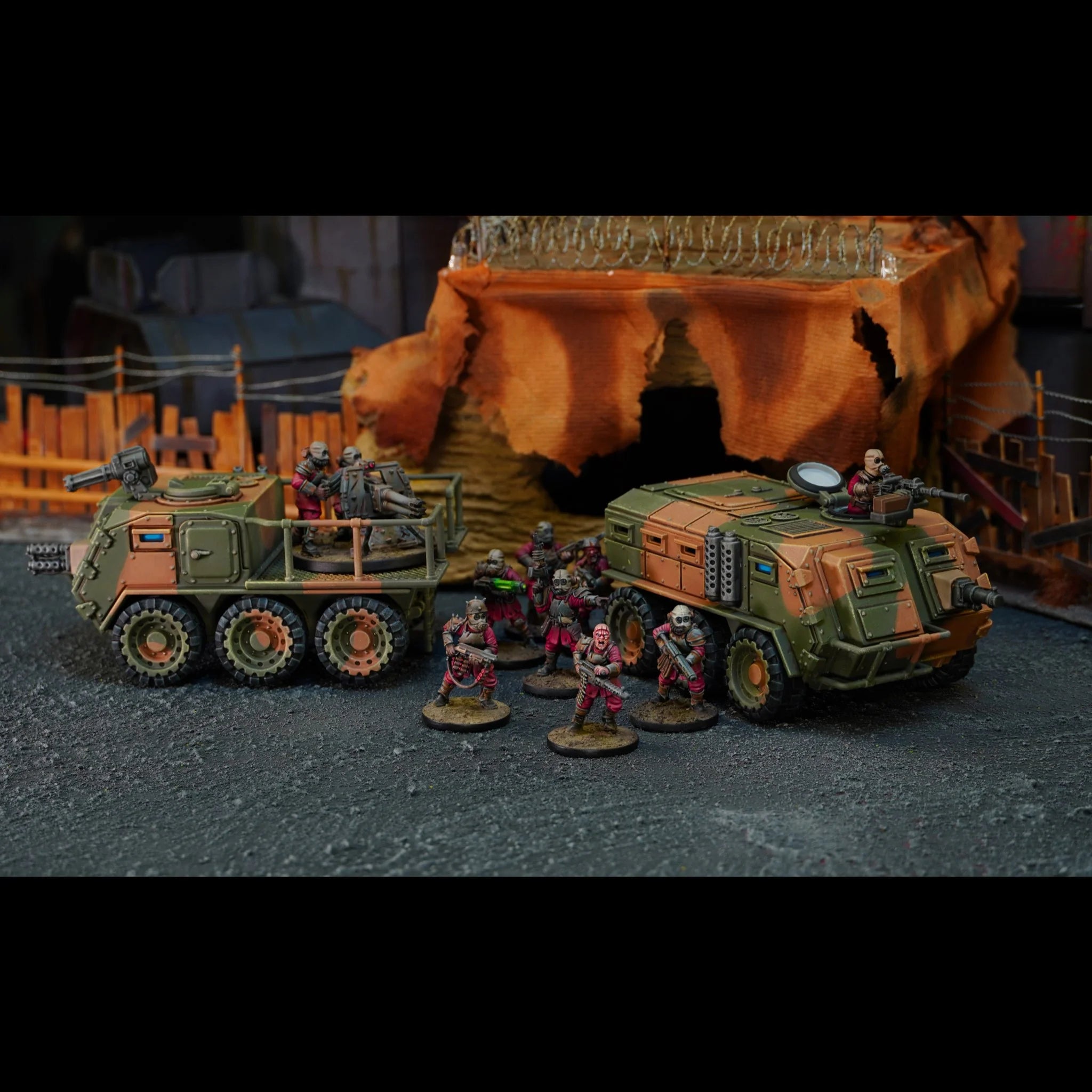 Two painted 28mm Damned Mauler vehicles shown in open flatbed and enclosed transport versions