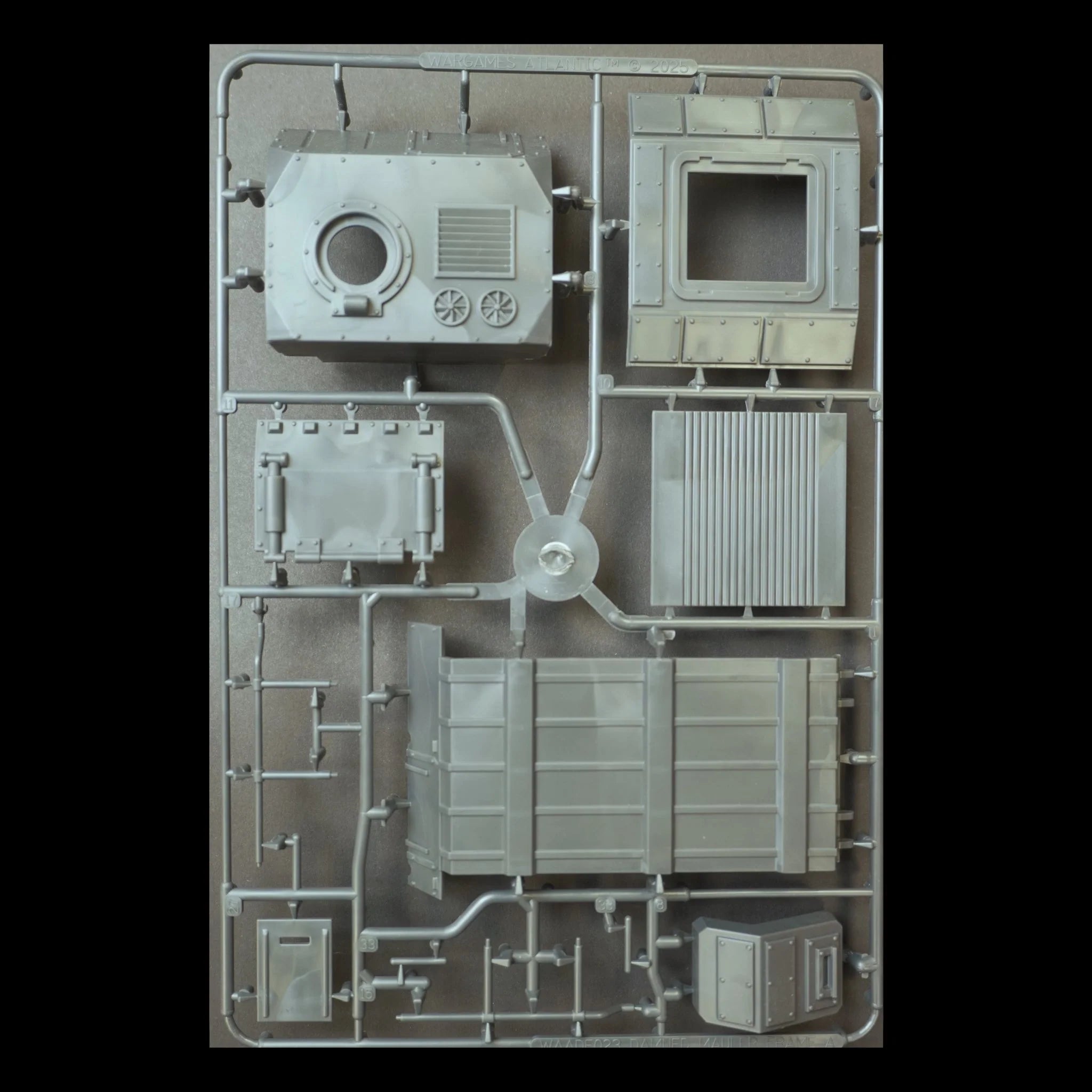 Front view of sprue frame B for the Wargames Atlantic Death Fields The Damned Mauler kit featuring armored hull and chassis panels