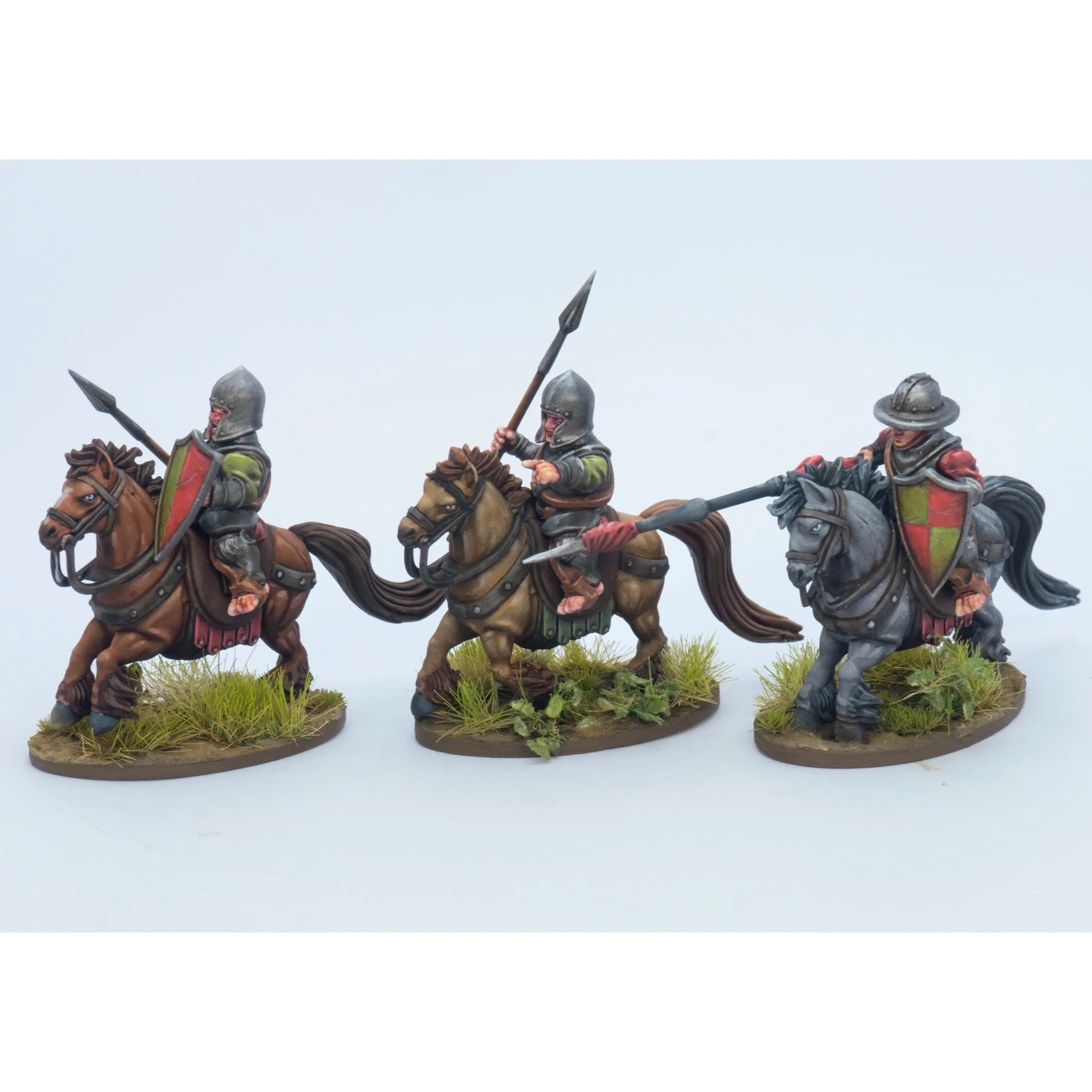 Three painted Halfling Cavalry miniatures armed with lances and riding brown and gray horses