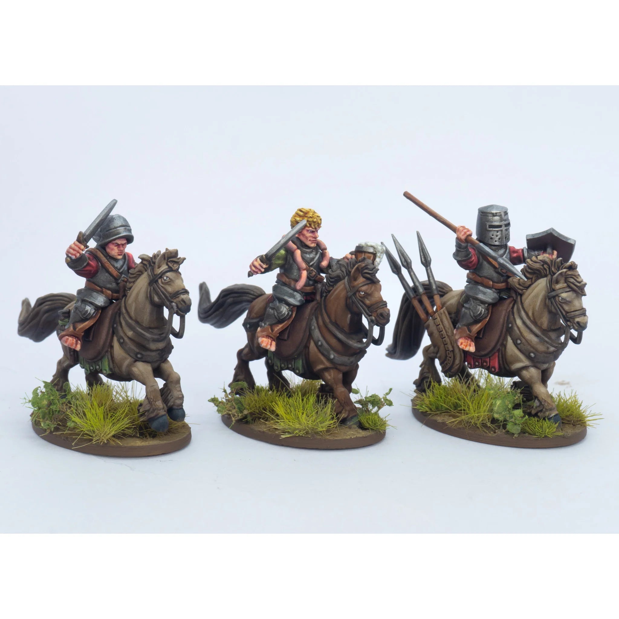 Detailed close-up of three painted halfling riders holding swords and a lance with a shield quiver