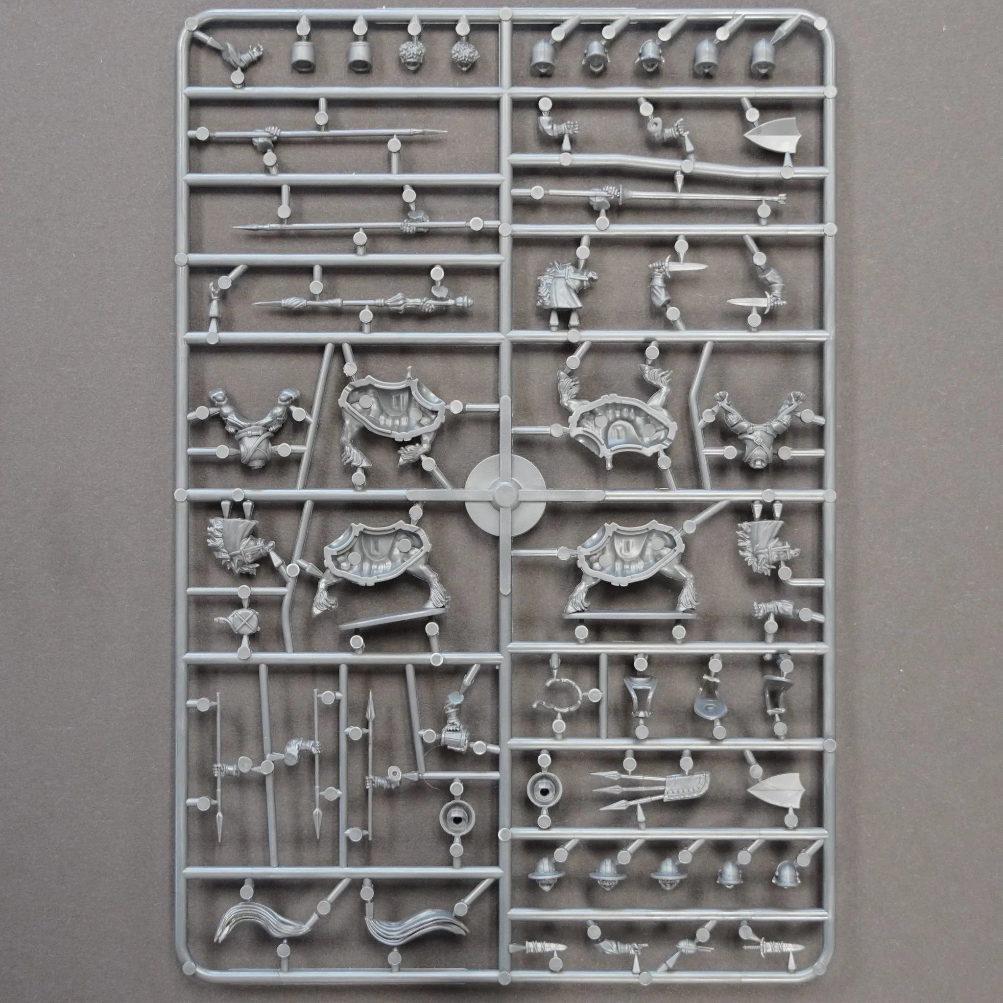 Rear view of the Wargames Atlantic plastic sprue showing part layouts and multiple head options