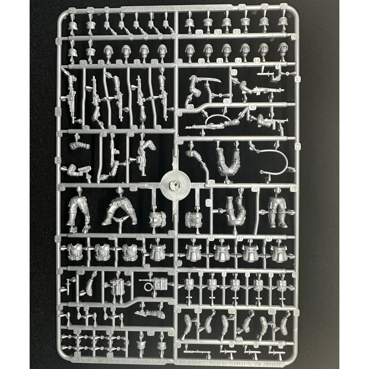 Front perspective of the unpainted gray plastic Wargames Atlantic Marcher US Infantry sprue