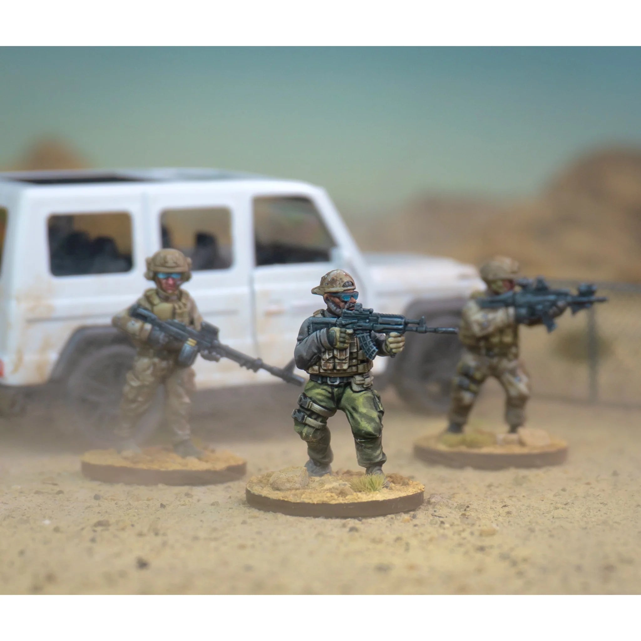 Painted example of Wargames Atlantic Operators in desert camouflage.with Land Cruiser