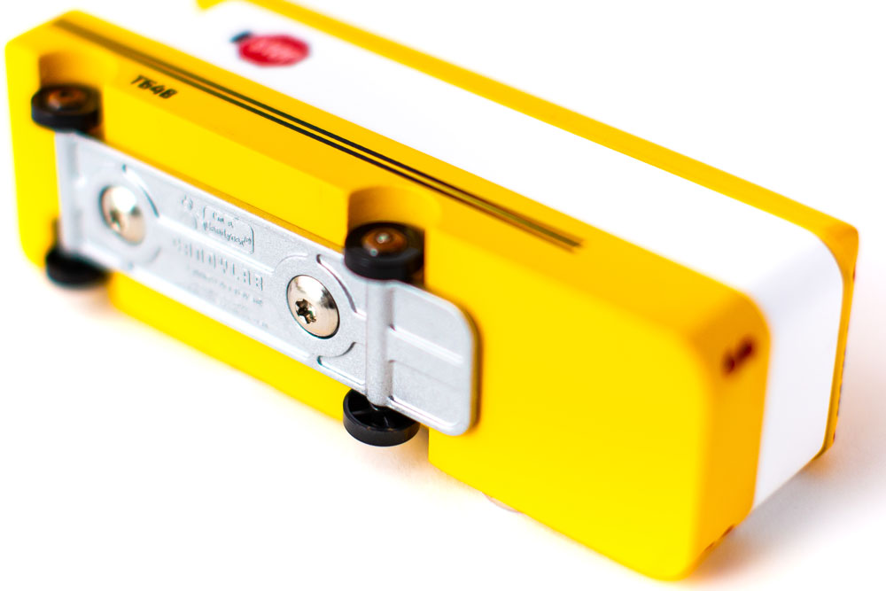 Candylab Toys School Bus Wooden Vehicle – Underside View Showing Metal Chassis and Wheels