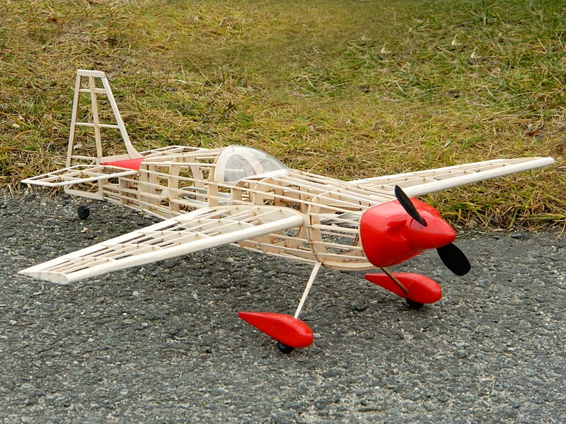 Assembled balsa wood airframe skeleton of the Guillow's Zivko Edge 540 model airplane on plans.