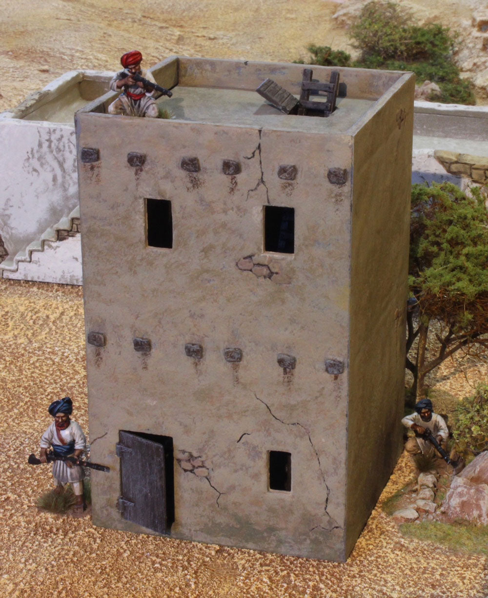 Painted large two-story adobe house from the Renedra 28mm scenery set with rooftop parapet access and miniature skirmish figures.