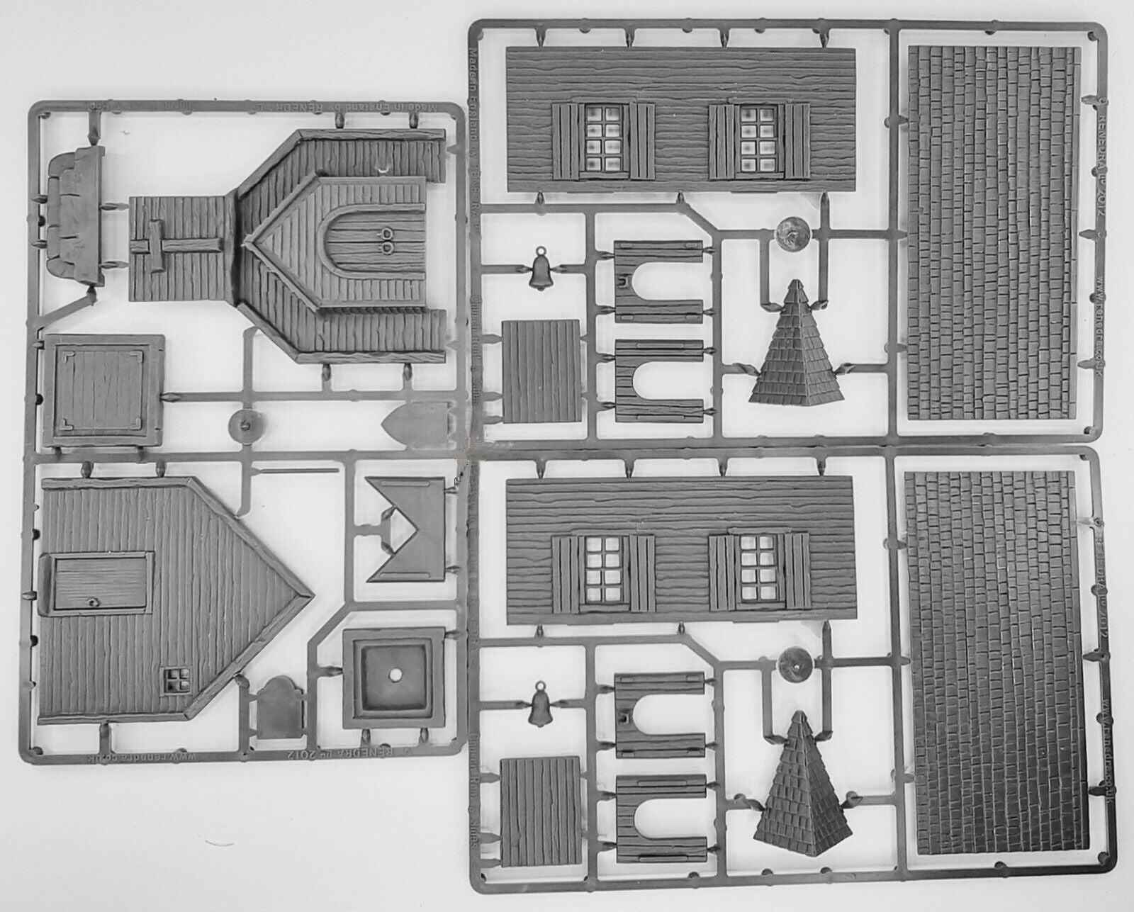 Gray hard plastic sprue frames for the Renedra American Church building kit showing wall panels roof shingles and belfry parts.