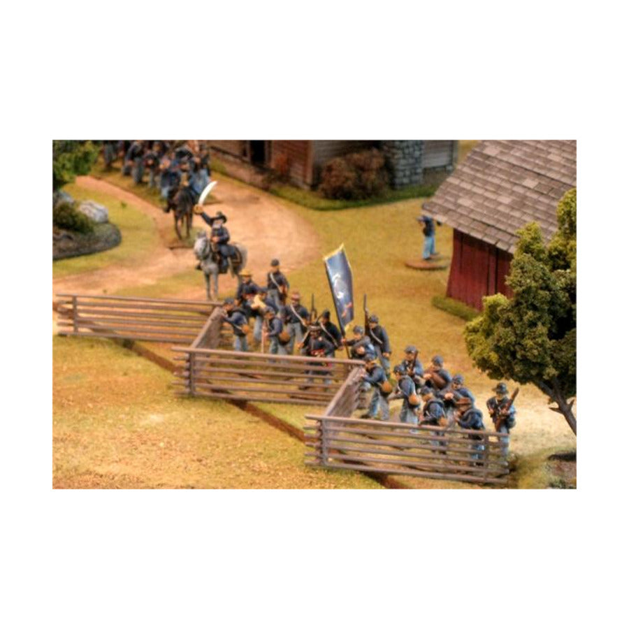 Assembled Renedra 28mm worm fence providing cover for miniature American Civil War infantry advancing near farm buildings
