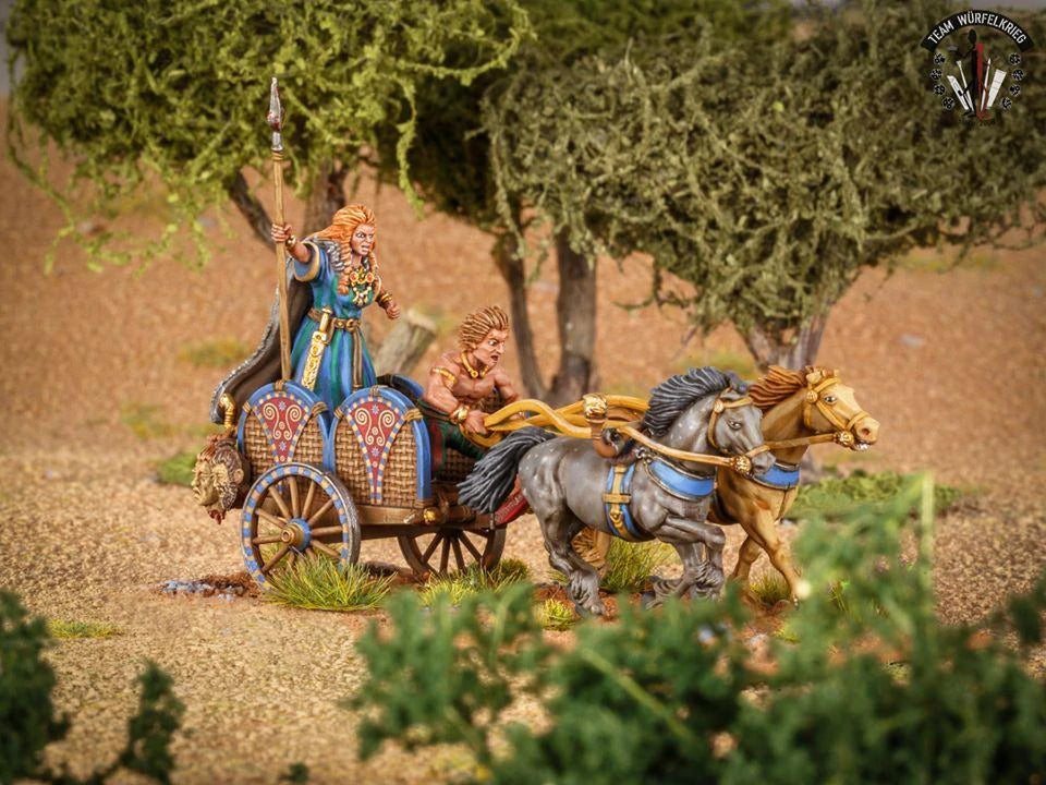 Painted Victrix 28mm Celtic chariot with Queen Boudicca galloping across a scenic grassy terrain 