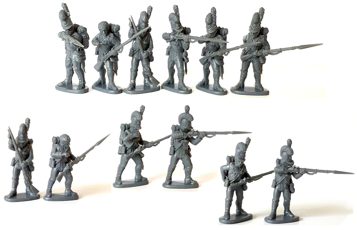 Unpainted gray plastic assembled Victrix 28mm Bavarian infantry models in firing line and loading poses