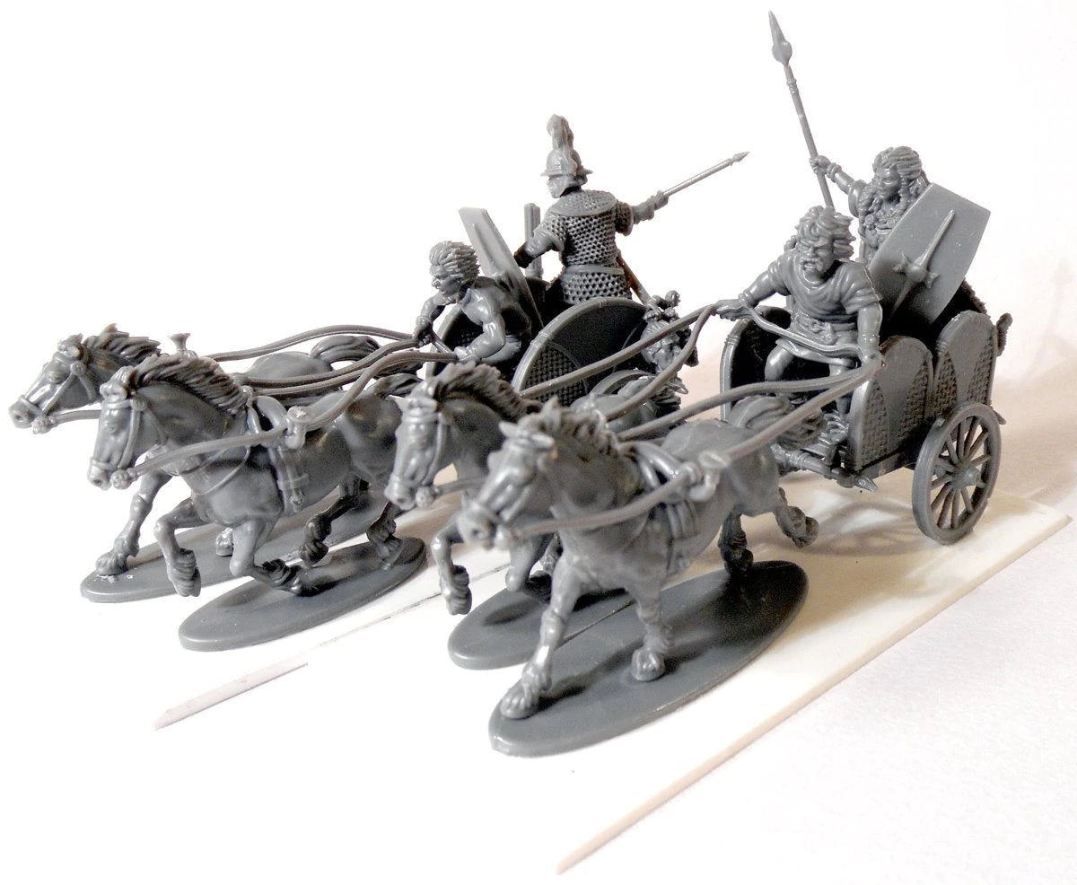 Two assembled unpainted gray plastic Victrix 28mm Celtic chariots with horses and crew 