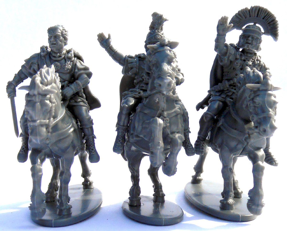 Early Imperial Roman Generals, Three assembled unpainted gray plastic Victrix 28mm Roman mounted officers viewed from the front